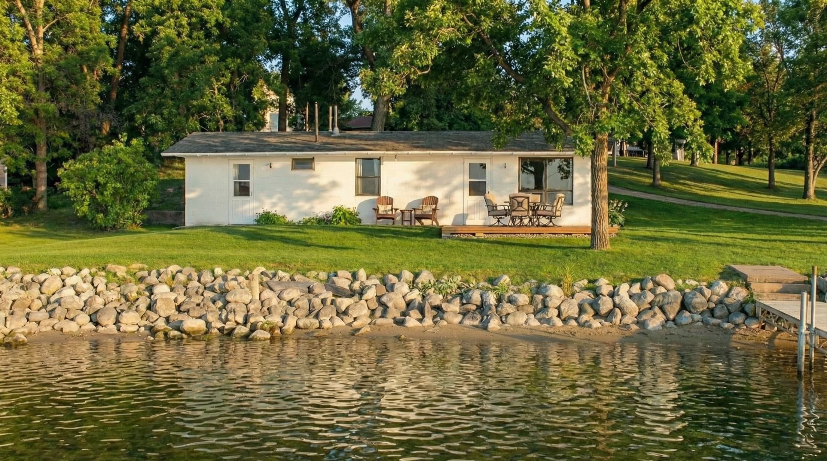 White Cabin beside the water at Lake Victoria Resort.